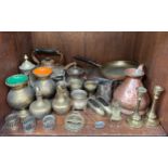 A collection of assorted metalwares, comprising, a copper ‘Quart’ jug, two cast-iron cow dishes on