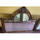 A 19th century oak overmantle mirror, possibly previously the back to a sideboard, with central