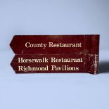 Two painted aluminium direction signs, one reading ‘Country Restaurant’, the other ‘Horsewalk