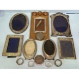 Six various silver photo frames by Walker and Hall, to include, a pair of oval form photo frames