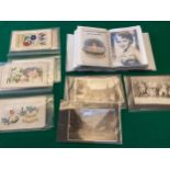 More than 80 standard-size postcards in a small album or plastic sheets with a varied selection