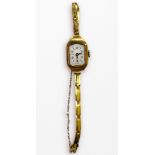 An 18ct gold cased ladies wristwatch, the silvered dial with batons and Arabic numerals denoting