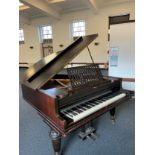 A Broadwood mahogany grand piano, serial number 50180, with music rest and raised on brass