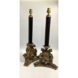 A pair of early 20th Century Elkington Baroque style table lamps, modelled as fluted black columns