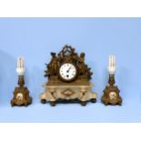 A gilt-spelter and onyx marble mantel clock surmounted with pastoral figures, together with a pair