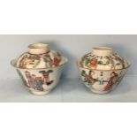 Two various Chinese polychrome famille rose porcelain tea bowls and covers, the first painted to