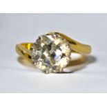 An 18ct yellow gold solitaire diamond ring, the round brilliant cut diamond estimated 2.50cts, I