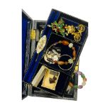 Blue jewellery box with various beads and brooches etc.
