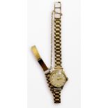 A ladies 9ct gold cased Tissot wristwatch, the silvered dial with batons denoting hours and Arabic
