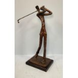 A stylised bronze sculpture of a golfer at full swing, signed ‘Kim Y.J.’ to base, approx. 37cm tall