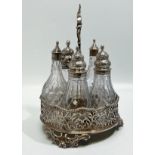 A George III Silver 5-bottle cruet stand, with scrolling foliate handle and feet, gadrooned wavey