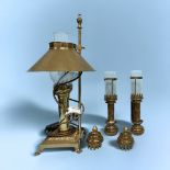 A reproduction brass ‘Orient Express’ table light, stylised as an oil lamp, claw feet to base,