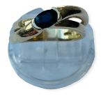 WITHDRAWN: A 14ct yellow gold dress ring, set with an oval faceted sapphire to the centre, in a