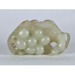 A Chinese Qing Dynasty pale celadon jade 'Squirrel and Grapevine' pendant, realistically carved with