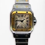 A ladies stainless steel and gold automatic Cartier Santos wristwatch, model 2423, the square