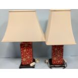 A pair of Oriental red and cream painted lamps /converted ginger jars and cover with foliate