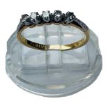 An 18ct gold 5 x stone ring, claw set with 5 x round diamonds, estimated total weight 0.15cts,