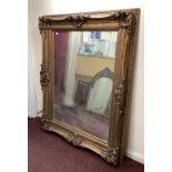 A large ornate gilt framed mirror, overall size 130cm x 160cm