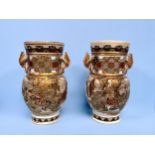 A pair of 19th century Japanese Satsuma pottery vases, typically decorated with gilding and