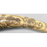 A facsimile Narwhal tusk realistically modelled in resin, together with a simulated large