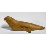 A vintage Walrus-calf doll, with natural white fur over a wooden body with marine ivory tusks,