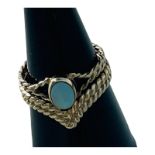 A 9ct yellow gold rope design dress ring, rub-over set with an oval opal, measuring 6mm x 4mm,