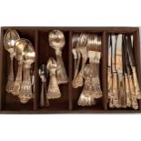 A tray of silver-plated shell pattern flatware for six place settings, comprising, forks, knives,