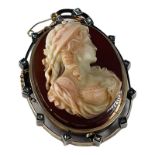 A French Victorian hardstone carved cameo brooch, set with a cameo of a woman's head and bust,