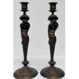 A pair of early 19th century cast metal candlesticks in the Greek Revival style, modelled as