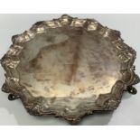 A small George III silver salver by Richard Rugg I, with srpentine and shell border, bull crest to