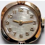 A ladies 9ct gold cased wristwatch, the pearlescent dial with applied Arabic numerals denoting