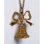 Two various 9ct gold necklaces and pendants, one modelled as a bell with bow, the other as acorns