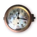 A Third Reich Kriegsmarine Bulkhead Clock, the 16cm/6¼in. silvered dial with Arabic numerals,