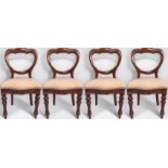 A set of four Victorian mahogany balloon back dining chairs with grey herringbone upholstered drop-