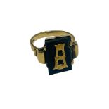 A 9ct yellow gold antique mourning ring, with a 9ct gold Initial 'A' on a panel of black onyx,