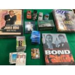A small collection of assorted James Bond items – various collectable cards; the official 200-page