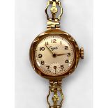A ladies 9ct gold cased Everite wristwatch, the silvered dial with Arabic numerals denoting hours,