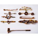 A collection of assorted 9ct gold and yellow metal testing as 9ct gold brooches including one