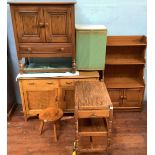 An Ercol Golden Dawn 'Crendance Cupboard' and matching 'Waterfall Bookcase' together with an oak