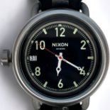 A gents Nixon ‘The October’ quartz wristwatch, the black enamel dial with alternating Arabic