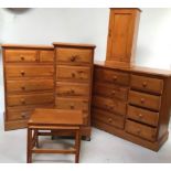Three variously sized matching modern pine chests of drawers, with turned pulls and bevelled