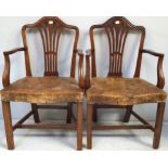 A pair of 19th Century mahogany carver chairs in the Chippendale style, with serpentine crest