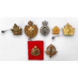 Seven various military cap and shoulder badges including Canada Military Police, Kings Own Malta