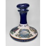 A British Navy Pusser’s Rum in Wade-style ceramic Pusser decanter and stopper, sealed with contents,