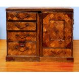 A 19th century Japanese parquetry and metal mounted travelling scholars' chest, with removable