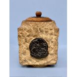 A WWII stone jar and cover with rose decorated oak lid inscribed 'This stone came from the Houses of