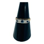 An 18ct yellow gold sapphire and diamond five stone ring, stones set in platinum top, ring weighs