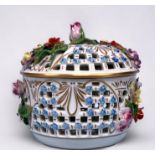A Dresden pierced pot an cover, ornately encrusted with pastel coloured flowers and gilt detail,
