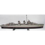 Three model boats on stands, built from scale model kits and fitted with motors, comprising a 1: