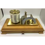 A ‘Regent Barograph’ by Negretti & Zambra’, with brushed brass base and engraved plaque, housed in